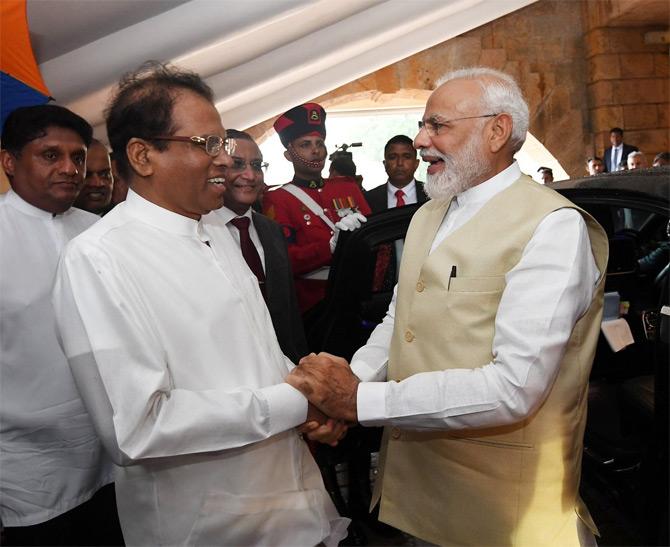In pic: PM Narendra Modi and Sri Lankan president Maithripala Sirisena bond with each other during their official meet in the Island nation. The two were pictured sharing a hearty laugh. We wonder what made PM Modi and Maithripala Sirisena crack up during the meet.
