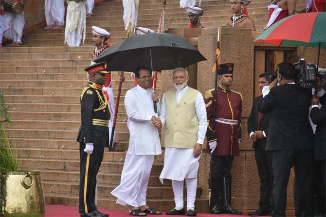 During his fruitful meetings with Sri Lanka's top leadership, PM Narendra Modi was greeted by rains but Sri Lankan President Maithripala Sirisena came to PM Modi's rescue with an umbrella. The SL president also went on to share a picture of the same.