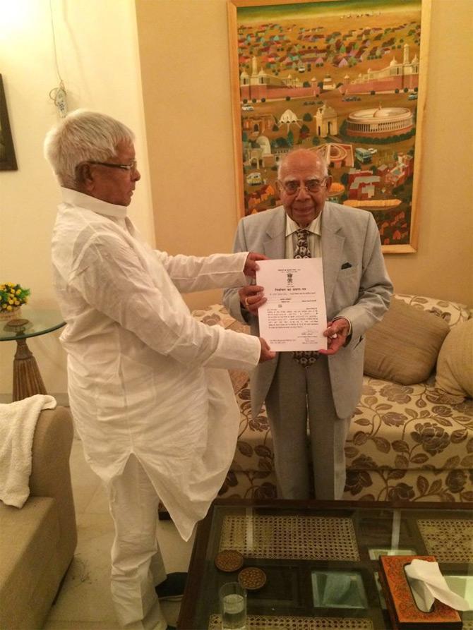 In pic: Lalu Prasad Yadav hands over his Rajyasabha MP certificate to Ram Jethmalani, Senior Advocate and Member of Parliament, Rajya Sabha.