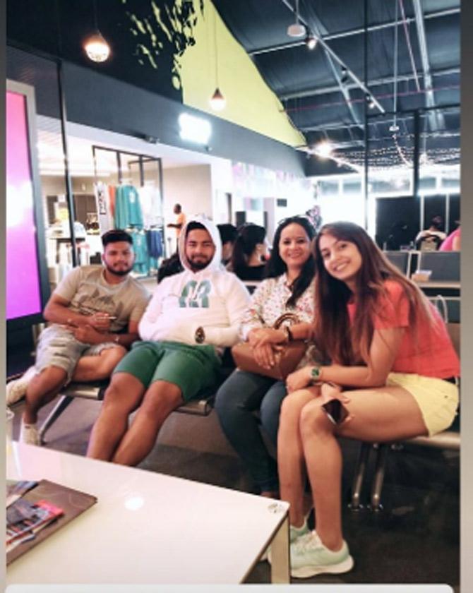 Sakshi Pant posted this picture with Rishabh Pant and family.