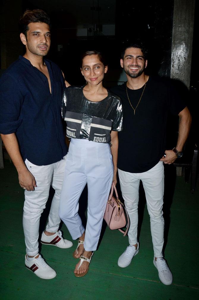 Anusha Dandekar, Karan Kundra posed with a guest when clicked at Rohini Iyer's bash hosted at her Santacruz residence.