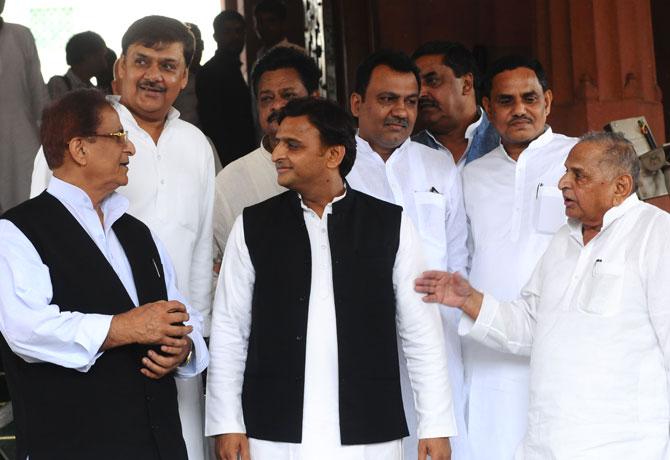 Samajwadi Party founder Mulayam Singh Yadav with his son and party president Akhilesh Yadav and MP Azam Khan on the opening day of the first session of the 17th Lok Sabha at Parliament House in New Delhi on Monday