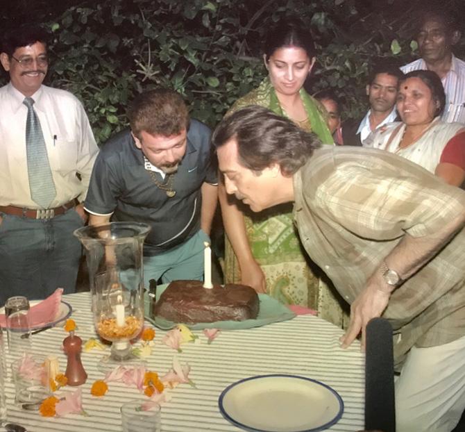Besides candid moments with family, Smriti Irani is also known to share rare, throwback pictures of herself with her friends from Industry, Bollywood, Politics, and more. Smriti shared this throwback picture with the late Vinod Khanna. During her acting days, Smriti produced 'Mere Apne' for 9X and portrayed the protagonist alongside Vinod Khanna.
In pic: Late Vinod Khanna blows his birthday candles as Smriti and Zubin Irani look on.