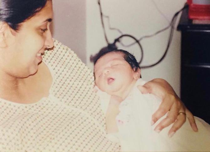 In pic: The doting mother that she is, Smriti Irani is seen taking care of her newly born child Zoish Irani. Smriti shared this #ThrowBack photo on the occasion of Zoish's birthday.
