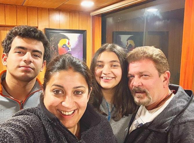 Smriti Irani who shares lovey-dovey pictures with hubby Zubin Irani, once took to Insta to share a rather adorable post and tagged her husband Zubin Irani. Smriti shared a pic of her house and wrote 'Home' as she seemed to be missing her home and her family. Her adorable post won hearts online and proved that 'Home is where the heart is'!
In pic: Smriti Irani poses for a selfie with hubby Zubin and her children, Zohr and Zoish.