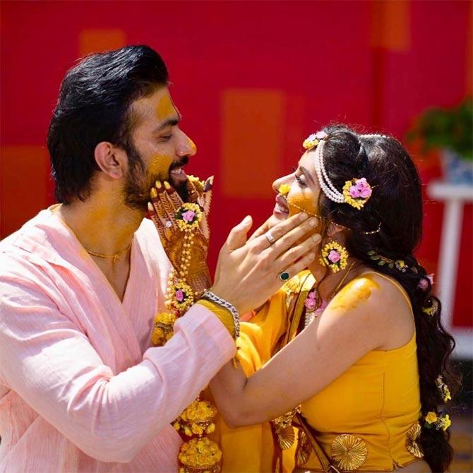 Rajeev Sen and Charu Asopa can be seen smearing haldi on each other's faces. Rajeev captioned the picture as, 