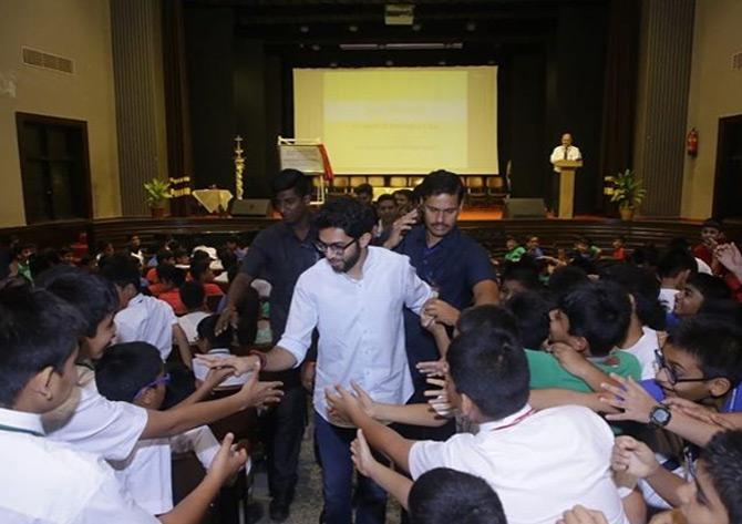 In pic: Aaditya Thackeray shakes hand with young students of St Mary's Mazgaon as he makes his way towards his car after attending the event.