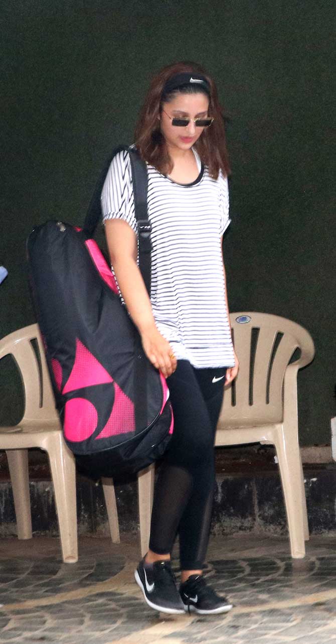 Parineeti Chopra is leaving no stone unturned to learn badminton for her upcoming film where she will be essaying the role of ace shuttler Saina Nehwal. The 30-year-old actress was snapped by the photographers practicing rigorously to get into the character and learn the art of playing the game. All Pics/Yogen Shah