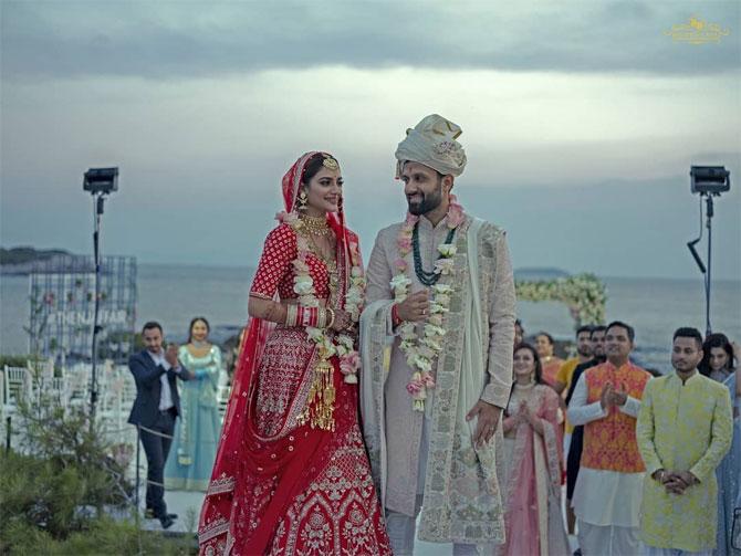 Nusrat looked resplendent in the red Sabyasachi Mukherjee lehenga, and the groom Nikhil Jain chose an ivory ensemble by the same designer for the D-day
