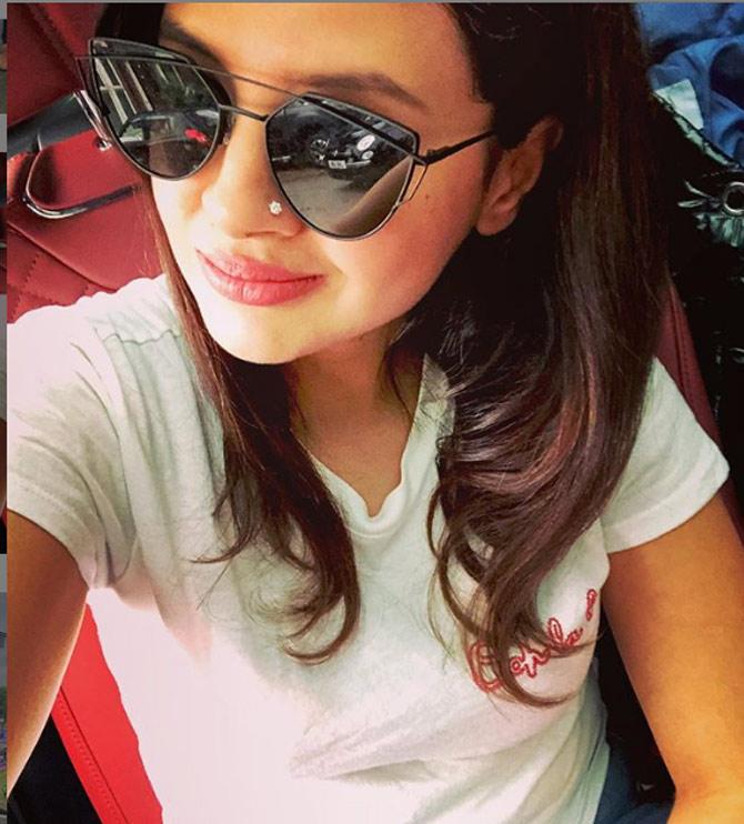 Sakshi Dhoni is known to be a selfie queen and always gets her selfies on point. here she is seen in a white top and cool shades.