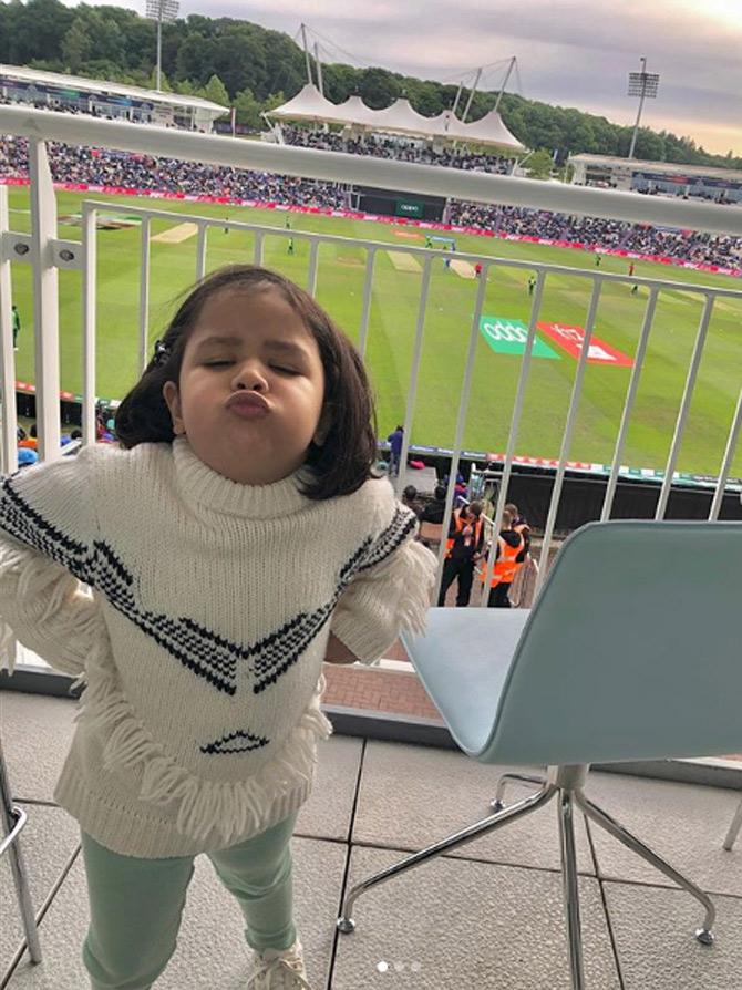 Now, that's a goodbye kiss! Ziva Dhoni is done for the day after entertaining all the guests in the VIP section with her cute antics.