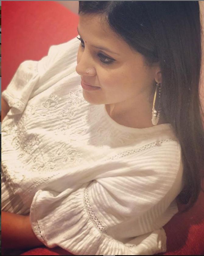 Sakshi Dhoni is seen here nailing the white top look. She is a constant campanion to MS Dhoni during matches.
