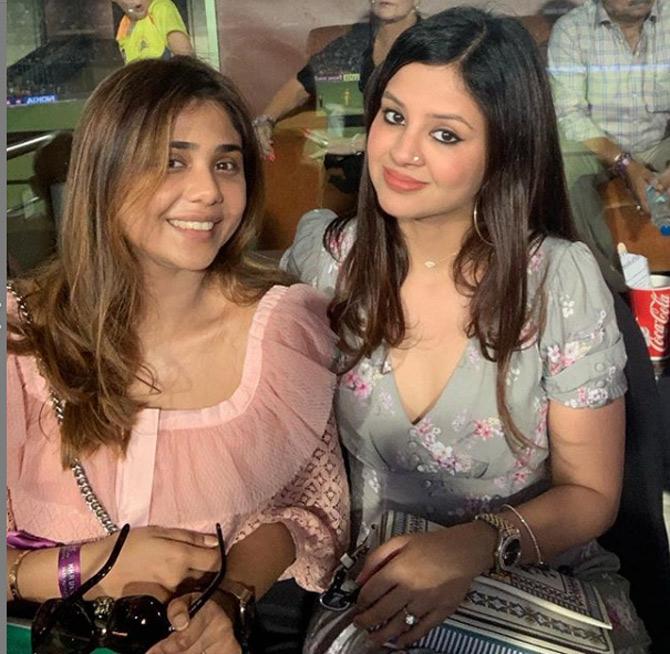 Sakshi Dhoni seen here in a grey dress with a friend during a World Cup match. Sakshi is from the hospitality industry and she sure knows how to work her trade with her friends.