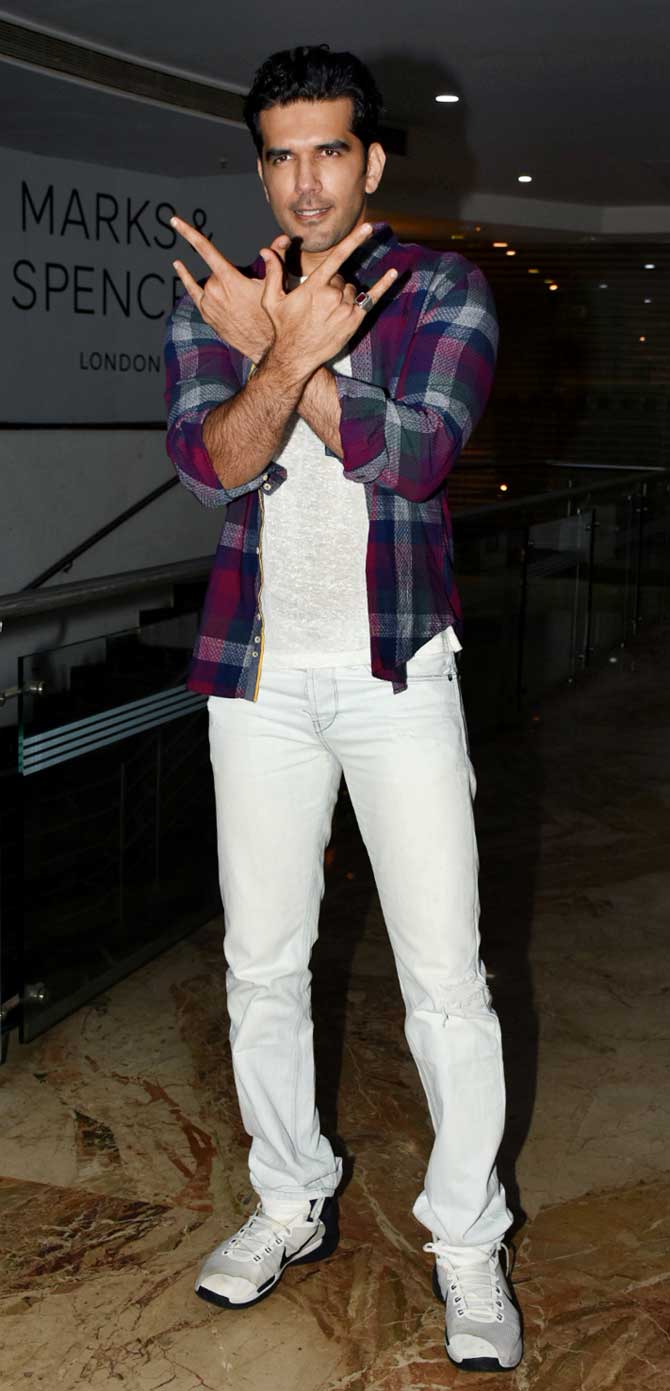 Taher Shabbir poses for the photographers at Bypass Road wrap-up party at a popular restaurant in Andheri.