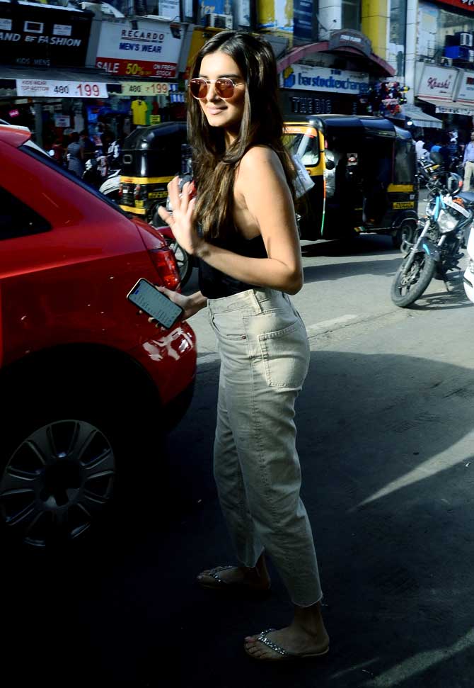 Tara Sutaria was on a shopping spree when she was clicked in Bandra. She looked absolutely adorable in a black tank top and grey trousers. 