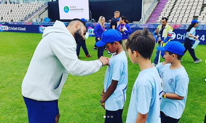 Virat Kohli posted this picture of himself talking to a few young kids during India's training and captioned it as, 