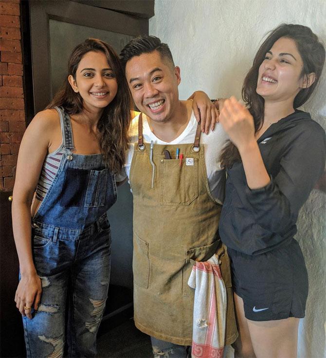 Kelvin Cheung won a few cooking championships when he was at a culinary school at Kendall College in Chicago
In picture: Kelvin Cheung with Rakul Preet and Rhea Chakraborty