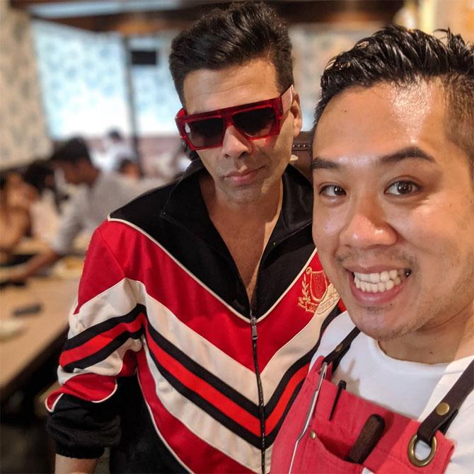 Kelvin Cheung loves feeding people and it is more rewarding for him to see people savour the food he cooks
In picture: Kelvin Cheung with Karan Johar