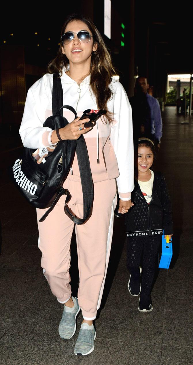 Isha Koppikar was snapped with daughter Rianna Narang at the Mumbai airport. The mother-daughter duo opted for a tracksuit as their airport look. On the work front, Isha Koppikar is set to make her digital debut with ALTBalaji's web series, Fixer. All pictures/Yogen Shah