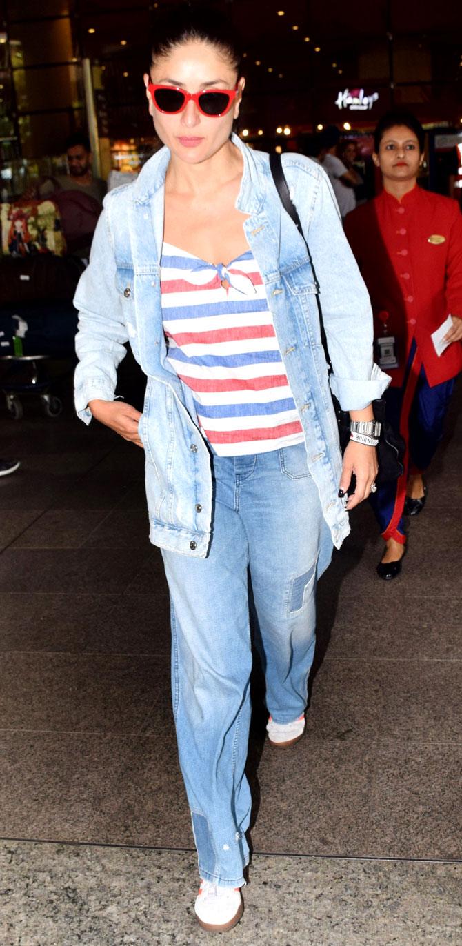 Kareena Kapoor Khan was spotted at the Mumbai airport. Bebo aced the airport look in a denim jacket, colourful striped tee and denim. The actress returned from her holiday in London, minus Saif Ali Khan and Taimur. All pictures/Yogen Shah
