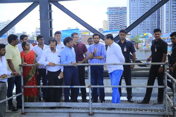 In pic: Aaditya Thackeray interacts with BMC officials post the inauguration ceremony of the water pumping station as others look on.