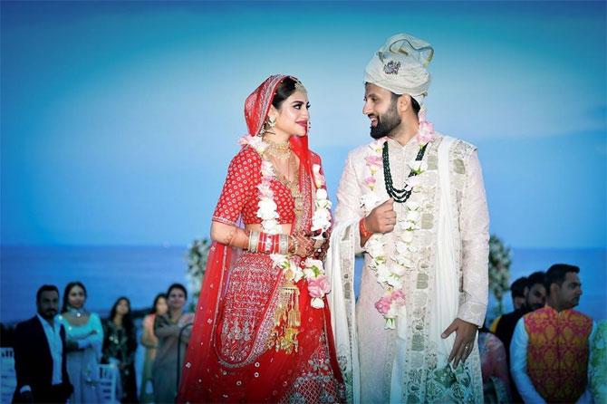 Nusrat Jahan looked resplendent in the red Sabyasachi Mukherjee lehenga, while her husband Nikhil Jain chose an ivory ensemble by the same designer for their D-day. The wedding planning firm Weddings by ESL managed the intimate affair in Bodrum, Turkey. Before leaving for the destination wedding, which was only attended by the bride and groom's close family members and friends, there was a Haldi ceremony held in Kolkata. The pre-wedding functions included a Yacht Party, Bohemian themed Mehendi Party, Sun Kissed Party which happened in Bodrum