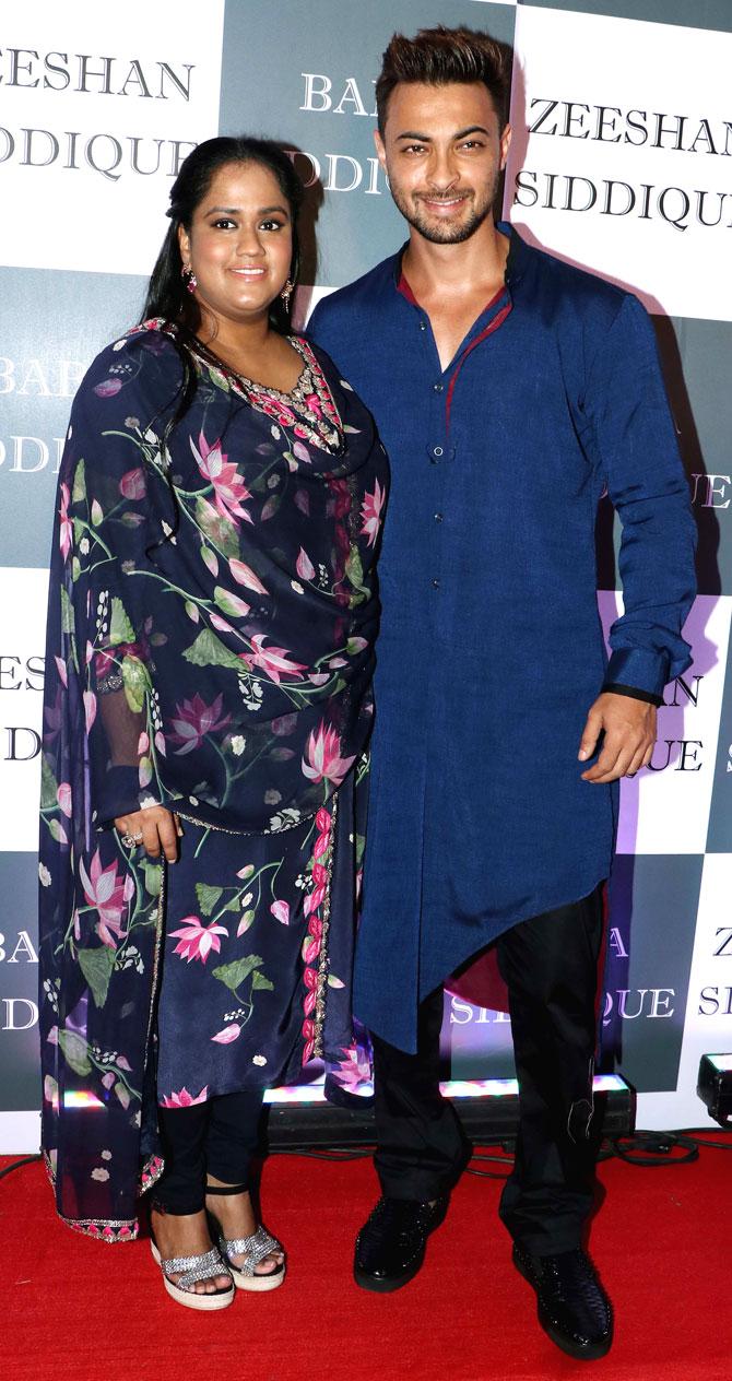 LoveYatri actor Aayush Sharma and wife Arpita Khan Sharma pose for the photographers at Baba Siddique's Iftar party.