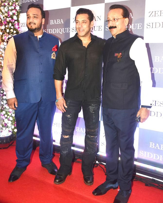 Former Congress MLA Baba Siddique's Iftar party is considered as one of the most exciting events as it provided a platform to then rivals Salman and Shah Rukh, in 2013, to forget their enmity and embrace each other. For the past several years, his Iftar has become the talk of the town as it acted as a stage for Salman and Shah Rukh to forget their enmity and embrace each other.
In picture: Salman Khan with Baba Siddique and his son Zeeshan pose for the photographers at the Iftar bash.