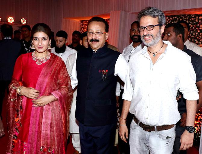Raveena Tandon and husband Anil Thadani pose with Baba Siddique at his Iftar party at Bandra 5-star hotel.