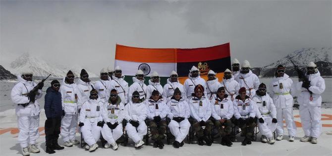 In pic: Defence Minister Rajnath Singh poses for a group photograph with Army Chief Gen. Bipin Rawat, General Officer Commanding-in-Chief of Northern Command Ranbir Singh and jawans of the Indian army at Siachen glacier.