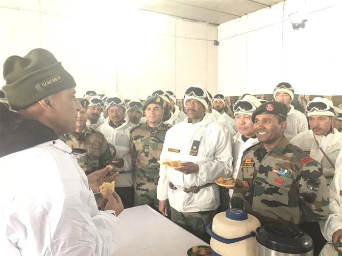 In pic: Defence Minister Rajnath Singh shares snacks with Army jawans during his visit to the world's highest battlefield, Siachen, situated in Jammu and Kashmir.