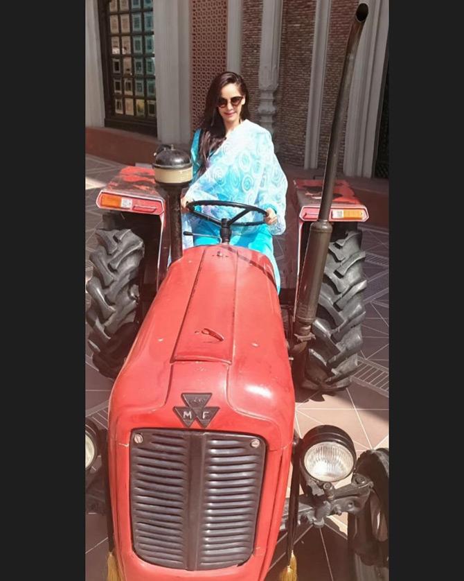 In pic: Ruby Dhalla tries her hands at the tractor during one of her trips to India. While sharing this picture, Dhalla captioned it: Be open to Change... Old thoughts don't take you to new destinations.