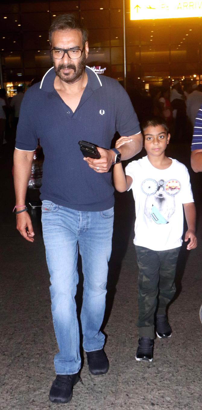 Ajay Devgn and son Yug were spotted at the Mumbai airport. Ajay's father and veteran Bollywood action choreographer and filmmaker Veeru Devgan passed away on May 27. In the moment of grief for the Devgn family, Ajay Devgn expressed his gratitude towards everyone who prayed and supported his family during a tough time. Ajay took to his twitter handle and wrote, 