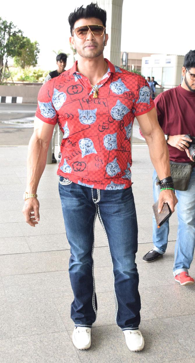 Bollywood actor Sahil Khan was snapped by the photographers flexing his muscles in his red polo t-shirt and denim. The Style actor may have disappeared from the Bollywood scene, but he is leading life king-size filled with parties and vacations. All Photos/Yogen Shah