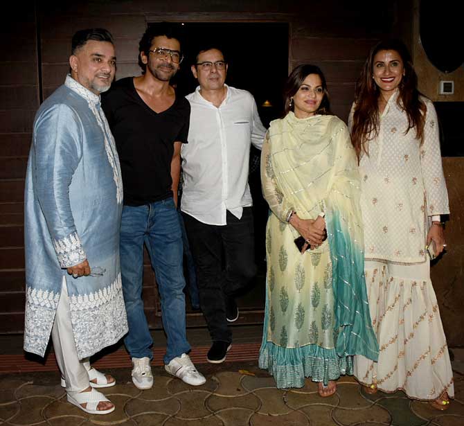 Sunil Grover, Atul Agnihotri and Alvira Agnihotri with Raza Baig at the Eid bash. The long term friends posed for the shutterbugs as they arrived for the celebration. 