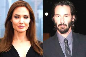 Does Angelina Jolie want to date Keanu Reeves?