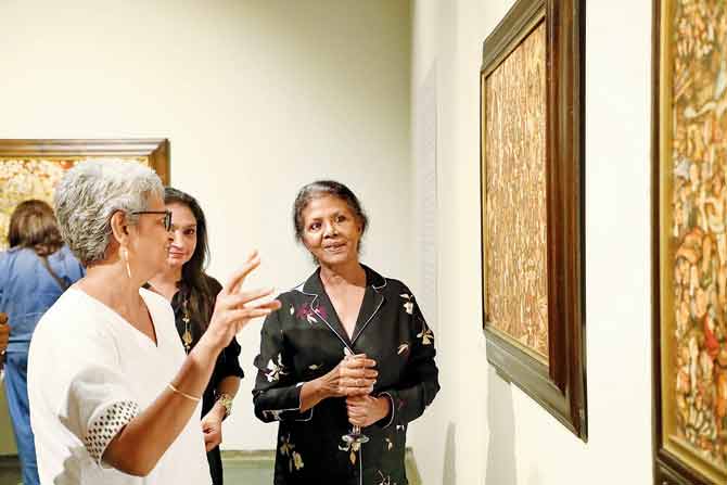 Milburn Cherian (in black) at the opening of the exhibition