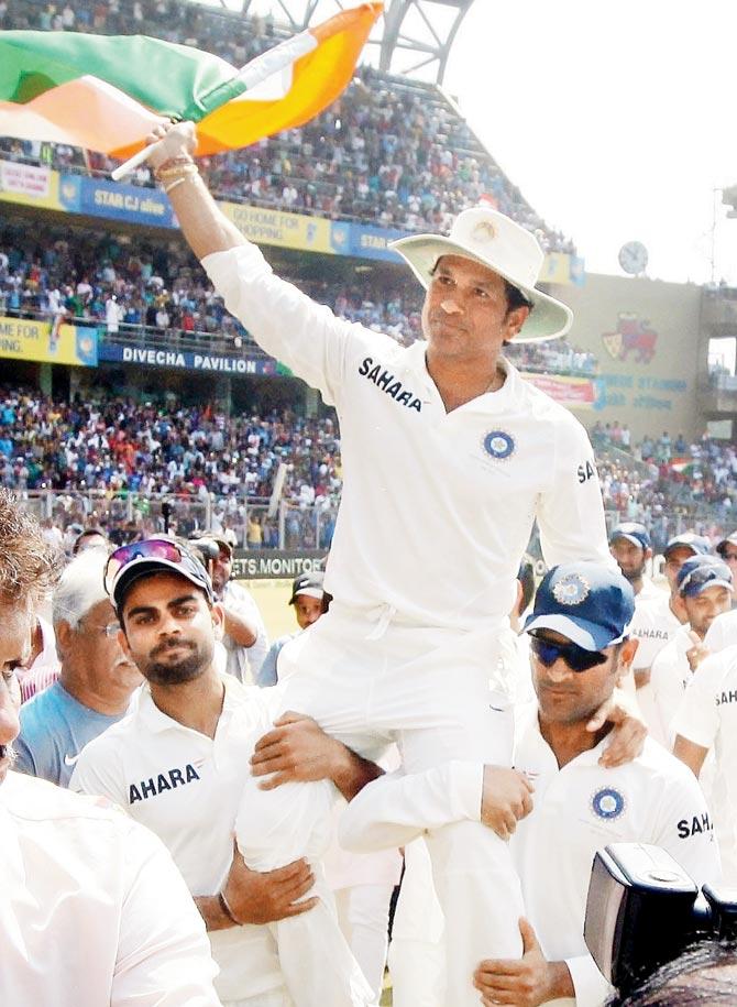 Sachin Tendulkar lifted by Virat Kohli (left) and MS Dhoni at the conclusion of his farewell Test
