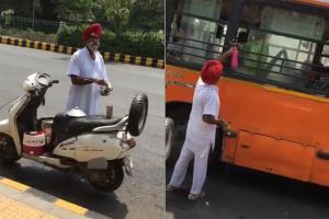Internet hails old man serving water to pedestrians in sweltering heat