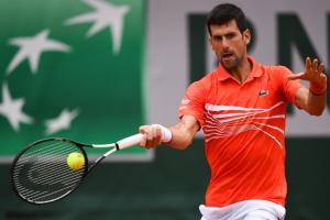 Djokovic sets French Open last-eight record as Halep wins in 45 minutes