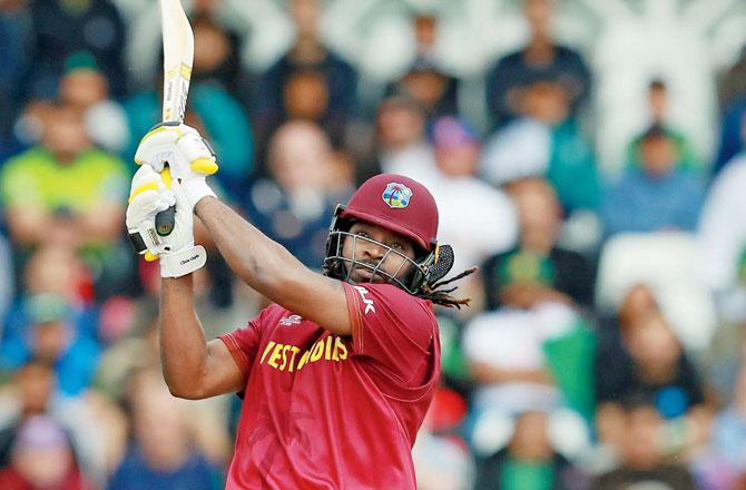 WI opener Chris Gayle en route his half century against Pakistan at Trent Bridge yesterday. Pics/Getty Images