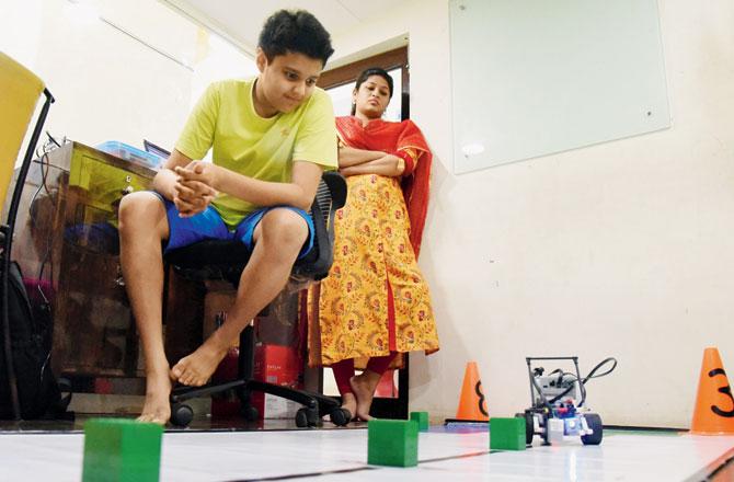 Shivraj Shah, 12, a Bombay Scottish School student uses a block programme, Lego Mindstorms, to get his robocrane to move forward and grab objects. But, what coding has also helped him with is mathematics. "Earlier, I used to be weak in maths, but I think I caught on to it after I started coding." Pic/Nimesh Dave