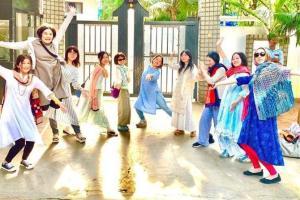Prabhas' Japanese fans pose outside his house in Hyderabad