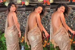 Watch Video: Priyanka puts 'sultry in summer' with this backless saree