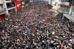 Hong Kong leader apologises as massive rally chokes city