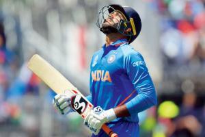 Vijay Shankar walks back after being dismissed for 14 against West Indies at Old Trafford in Manchester yesterday. Pic/AFP