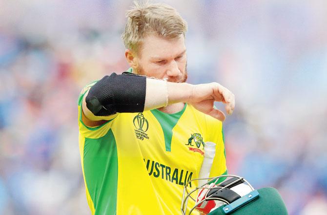 Oz opener David Warner walks back after being dismissed for 56 against India at The Oval on Sunday. Pic/Getty Images