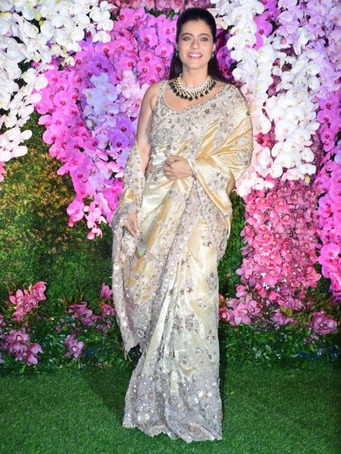 Kajol attended the glitzy celebration in honour of newly-weds Akash Ambani and Shloka Mehta in a silvery-white sari
