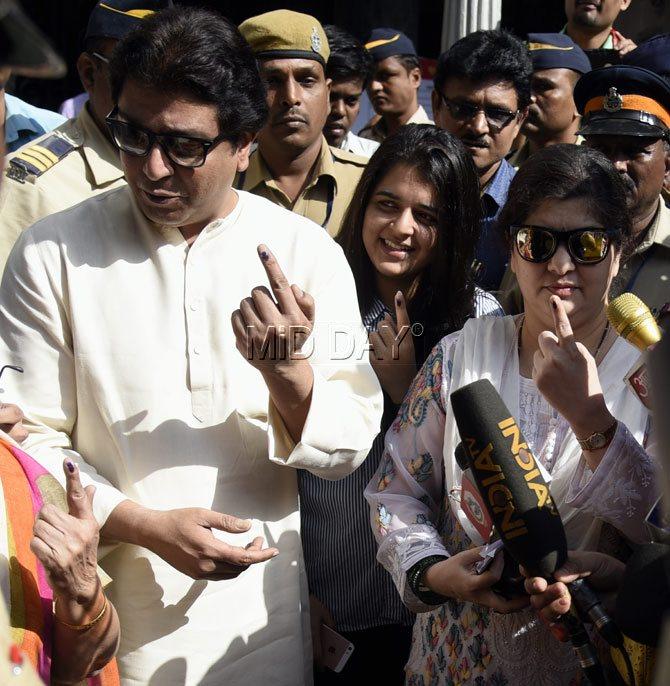 In picture: Raj Thackeray, wife Sharmila Thackeray and their children Amit and Urvashi pose for the paparazzi after casting their votes during the 2017 BMC elections in Mumbai.
 