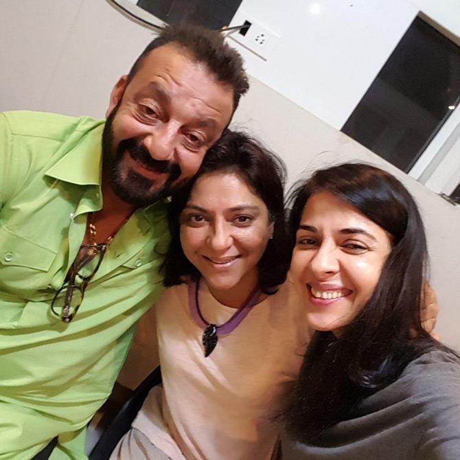 In picture: Sanjay, Priya, and Namrata Dutt are all smiles as they pose for a family photo.